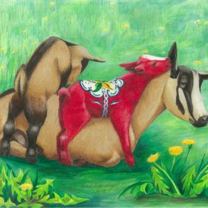 Nanny goat puts up with her curious kids climbing on her, one of which is a red dala goat