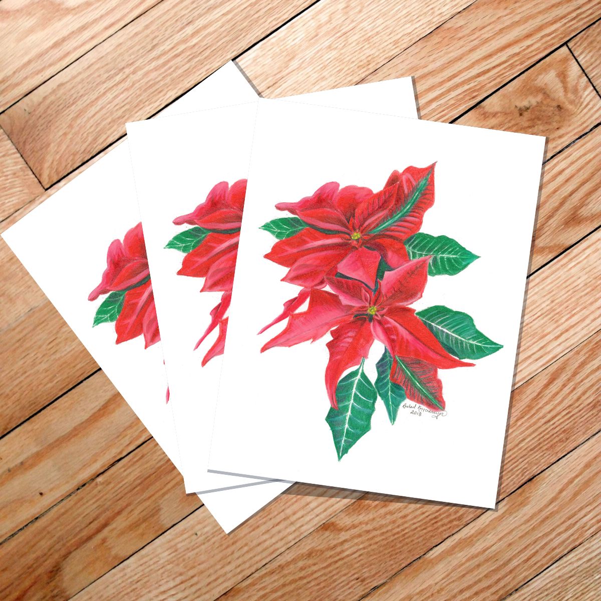 white notecards with red poinsettias
