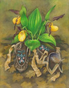 moccasins rest in the leaves under a cluster of yellow lady's slipper flowers
