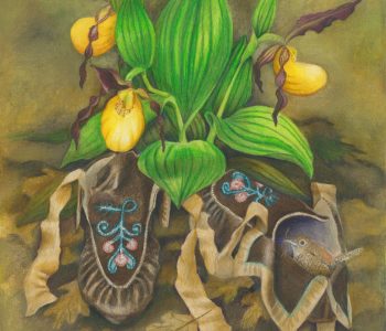 moccasins rest in the leaves under a cluster of yellow lady's slipper flowers