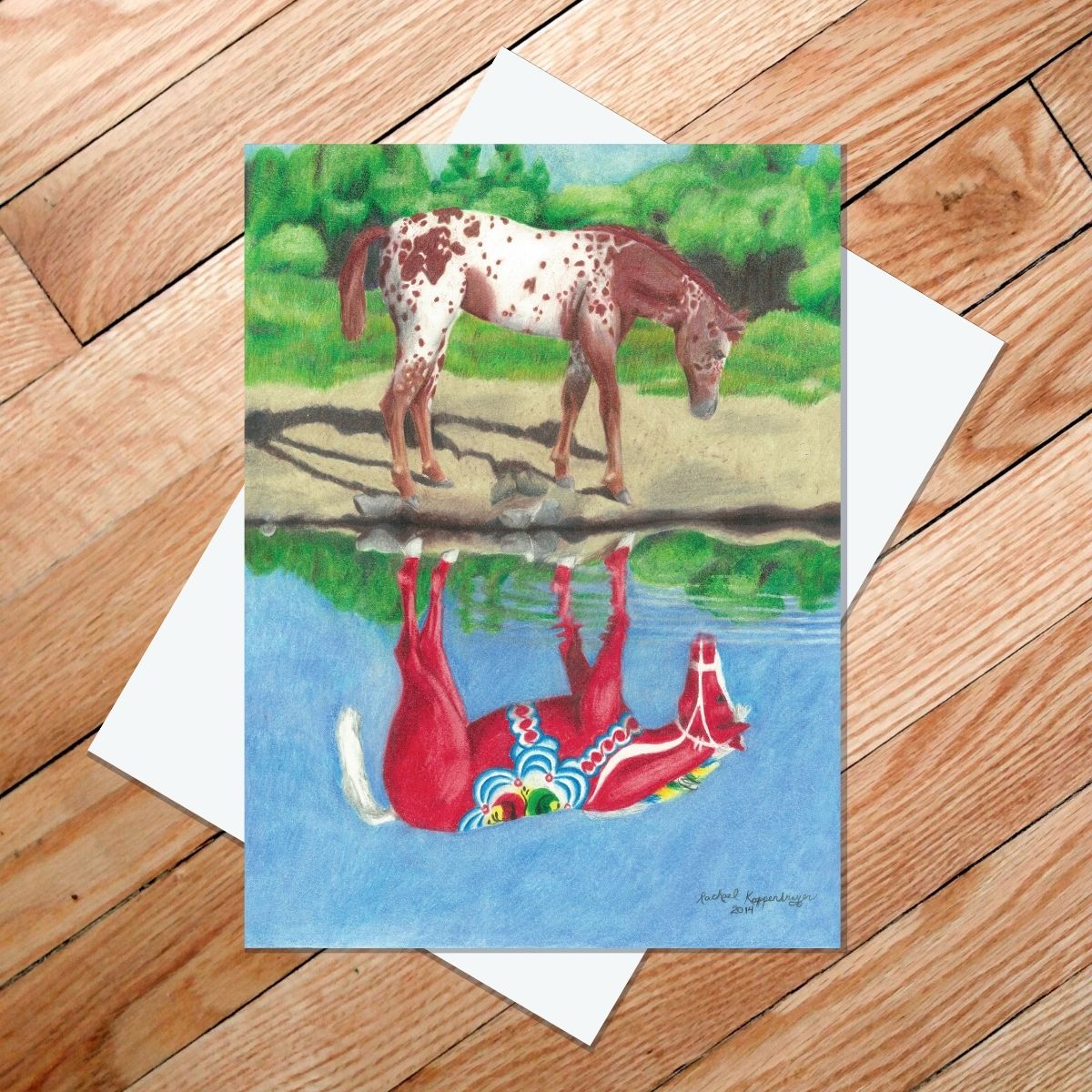 Greeting card of a strawberry roan appaloosa looking at its reflection of a red Dala horse