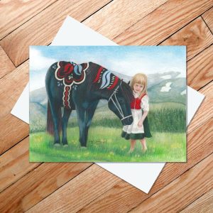 Greeting card of a black Dala horse nuzzling a little Swedish girl in folkdrakt
