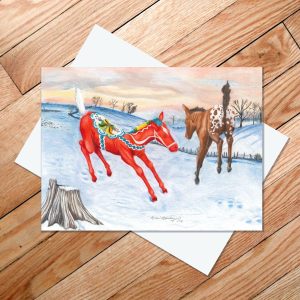 Greeting card of appaloosa foal and young dala horse leaping in fresh snow
