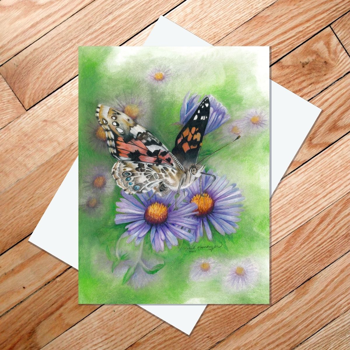 Greeting card of a painted lady butterfly on New England asters
