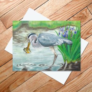 Greeting card of a great blue heron with a sunfish impaled on its beak
