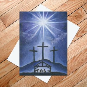 Greeting card of a Christmas star shining down on three crosses on a hill overlooking a manger scene