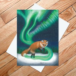 Greeting card of a red fox chasing his tail as the Northern Lights flow from it